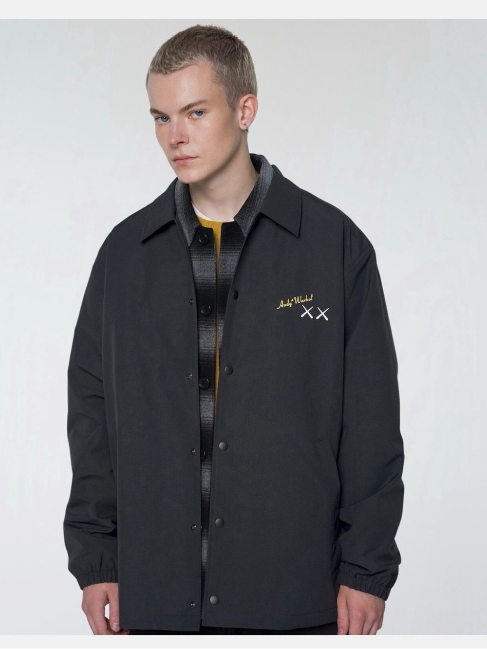Uniqlo x KAWS Black Coach Jacket with Yellow Accent
